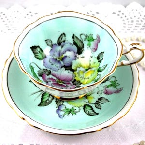 DW Paragon Beautiful Floral Duo, Colorful Pansies in the Center, Sky Blue Borders, Bone English China made in 1940s.