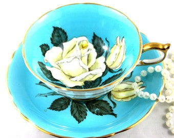 Outstanding Beauty, DW Paragon Cup & Saucer, Large White  Rose on Blue Background, Gold Rims, Bone English China made in 1950s