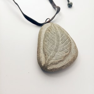 River stone pendant, Langa stone, with velvet lanyard, copper frame, natural beech leaf subject