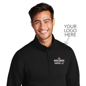 May include: Black mock neck sweatshirt with a zipper. The sweatshirt has a small embroidered logo on the left chest that says "WORLDWIDE PAINTERS, LLC".