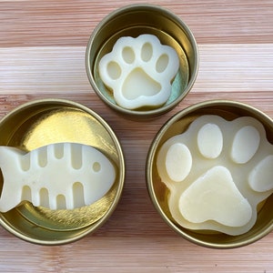 All Natural Paw & Nose Balm Protects Moisturizes. Multiple sizes, shapes, for cats and dogs. Lotion bar in reusable gold screw top tin
