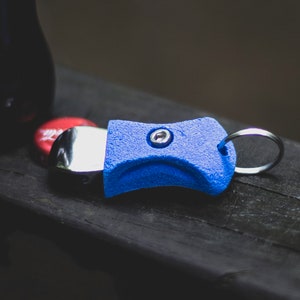 Portachiavi apribottiglie con impugnatura per arrampicata su roccia: regalo per scalatori