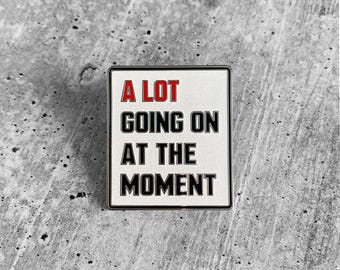 A LOT GOING ON Lapel Pin