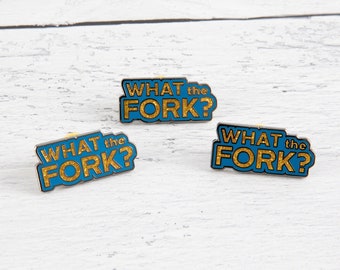 What The? lapel pin