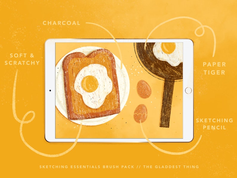 May include: A digital illustration of a tablet screen showing a breakfast scene with a fried egg on toast, a frying pan with a fried egg, and three eggs on a yellow background. The text "SKETCHING ESSENTIALS BRUSH PACK // THE GLADDEST THING" is at the bottom of the screen. The tablet is surrounded by a yellow background with handwritten text describing different brush styles: "SOFT & SCRATCHY", "CHARCOAL", "PAPER TIGER", and "SKETCHING PENCIL".