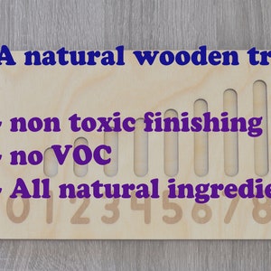 May include: A natural wooden tray with a non-toxic finish, no VOCs, and all natural ingredients. The tray has numbers 0-9 printed on it.