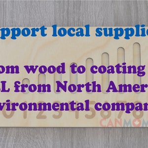 May include: A wooden board with the text "Support local suppliers" and "From wood to coating ALL from North America environmental companies" printed on it. The board has a series of slots cut into it, and the numbers 0-9 are printed on the bottom of the board. The board is made in North America.