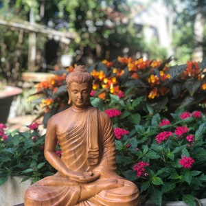 The Wooden Sitting Buddha statue