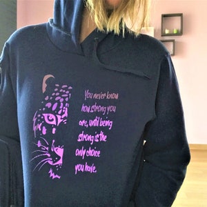 Blue hooded sweatshirt, motivational print on the front in iridescent metallic purple