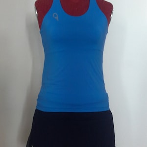 Tennis outfit with teardrop tank top and blue skirt with stretch tulle