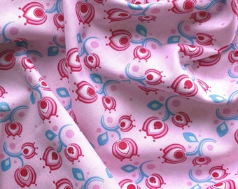 Flower swirl design by Aunt Ema, small flowers all over on a pink background, cotton, available from 0.5 m