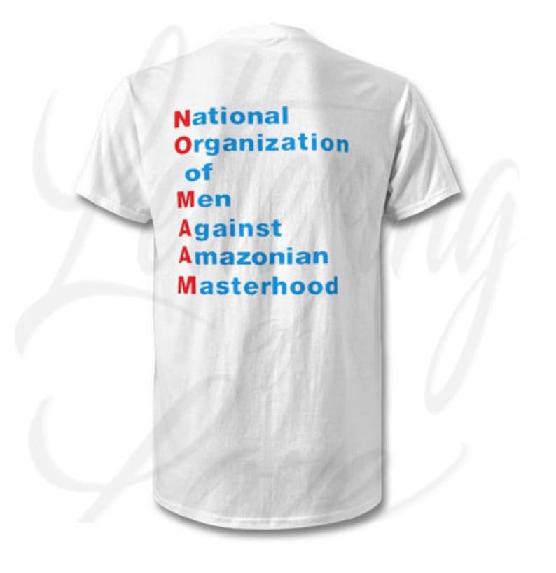 May include: White t-shirt with the acronym "NOMAM" spelled out vertically in red and blue letters. The letters stand for "National Organization of Men Against Amazonian Masterhood."