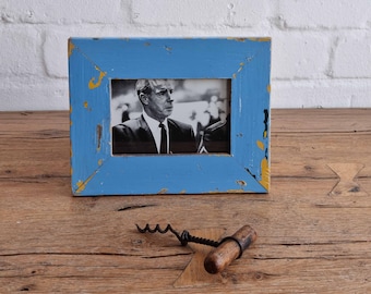 A 4x6 recycled timber photo frame by Luna Designs. Made from an authentic upcycled 60's skirting board in cornflower blue. A unique piece.