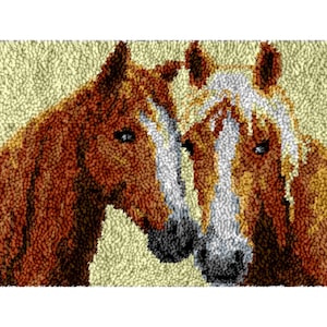 May include: A detailed textile art piece featuring two horses. The horses are depicted in shades of brown and white, with a textured, pointillist style. The background is a light beige color, and the horses are positioned close together.