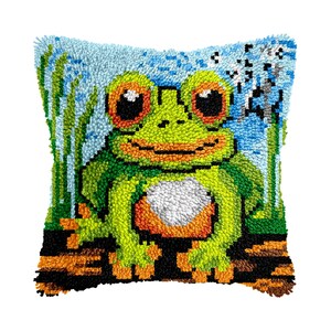 May include: A green frog with orange spots and large eyes is sitting on a brown log. The frog is surrounded by green grass and blue water. The frog is smiling and has a white belly. The background is a blue sky with white clouds.