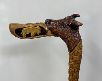 Hand made cane with deer head and bison handle carvings from one piece by sycamore tree.