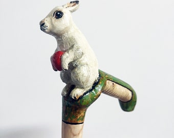 Hand carved wooden cane by cornel tree with white rabbit and red egg grip. One of a kind collectible animal cane.