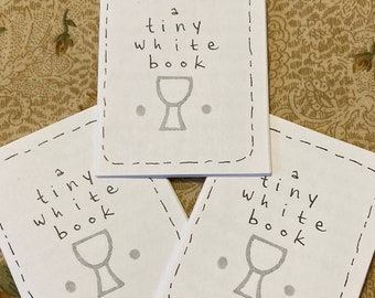 a tiny white book tarot zine