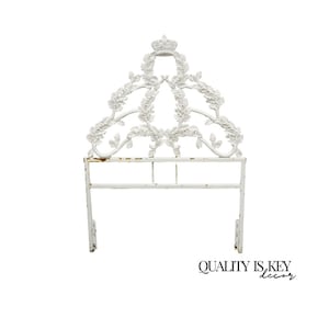 May include: White metal headboard with a crown and floral design. The headboard has a rectangular frame with decorative elements and a distressed finish. The text "QUALITY IS KEY decor" is visible at the bottom.