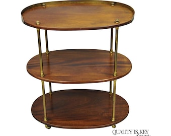 Mesa auxiliar con ruedas estilo campaña inglesa, ovalada, de caoba y latón, de 3 niveles
