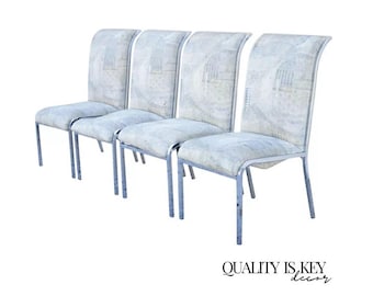 May include: Four dining chairs with a light blue and white patterned fabric seat and back. The chairs have a curved back and a chrome metal frame. The text "QUALITY IS KEY decor" is at the bottom.