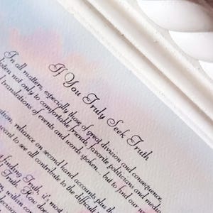 May include: White framed art print with the text "If You Truly Seek Truth" in elegant script. The background features a watercolor wash of pink and blue hues, creating a soft, artistic aesthetic.