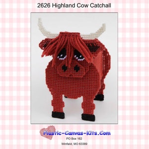 May include: A red Highland cow plastic canvas kit for making a tissue box cover. The kit features a red cow with white horns and a black nose. The kit is titled "2626 Highland Cow Catchall" and includes the text "Plastic-Canvas-Kits.com".
