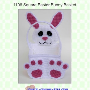 May include: White plastic canvas Easter bunny basket with pink ears and paws. The basket is square and has a handle. The text "Plastic-Canvas-Kits.Com" is printed on the bottom of the image. The text "PO Box 162 Winfield, MO 63389" is printed below the website address.
