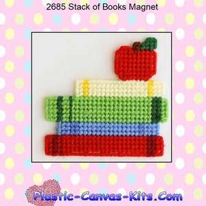 May include: A plastic canvas pattern for a stack of books with an apple on top. The books are red, green, blue, and white. The apple is red with a green stem and leaf. The pattern is for a magnet. The text "2685 Stack of Books Magnet" is at the top of the image. The text "Plastic-Canvas-Kits.Com" is at the bottom of the image.