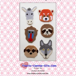 May include: A set of six plastic canvas animal face magnets. The magnets feature a donkey, red panda, monkey, sloth, pug, and wolf. The magnets are all white with colorful details. The magnets are on a pink and white polka dot background.