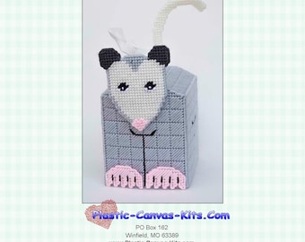 May include: A gray and white 3-D opossum tissue box topper craft pattern. The opossum has a pink nose and black eyes. The pattern is for personal use only and is not to be shared through email, email groups, etc. Finished product can be given as gifts, sold at craft shows, etc.