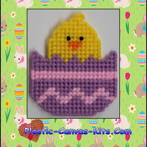 May include: A purple and pink plastic canvas Easter egg with a yellow chick inside. The egg is decorated with pink and purple stripes. The chick has a yellow body, orange beak, and black eyes. The image includes the text "1866 Chic in Easter Egg Magnet" and "Plastic-Canvas-Kits.Com".