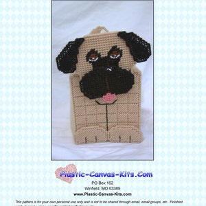 May include: A plastic canvas pattern for a pug-shaped tissue box cover. The pattern is beige with black and brown details. The pattern is titled "0198 Pug Tissue Topper" and includes the website "Plastic-Canvas-Kits.Com".