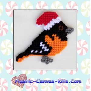 May include: A plastic canvas pattern for a Baltimore Oriole wearing a Santa hat. The pattern is orange, black, and white. The pattern is for personal use only and is not to be shared. Plastic-Canvas-Kits.Com