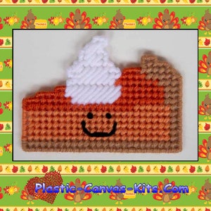 May include: A plastic canvas kit for a pumpkin pie magnet. The kit features a smiling pumpkin pie with a white whipped cream topping. The kit is labeled "1722 Pumpkin Pie Magnet".