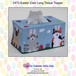 May include: A blue plastic canvas tissue box cover with an Easter theme. The cover features three cats with bunny ears, Easter eggs, and a light blue background. The text "2472 Easter Cats Long Tissue Topper" is at the top of the image.