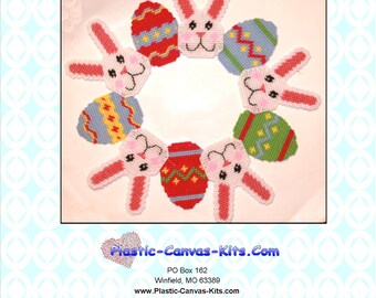 May include: A plastic canvas pattern for an Easter wreath featuring bunnies and eggs. The wreath is made up of six bunnies and six eggs, each with a different color and pattern. The pattern is available for purchase from Plastic-Canvas-Kits.com.