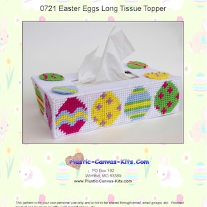 May include: A white plastic tissue box cover with a long rectangular shape. The cover is decorated with colorful Easter eggs with different patterns. The text "0721 Easter Eggs Long Tissue Topper" is at the top of the image. The text "Plastic-Canvas-Kits.Com" is at the bottom of the image.