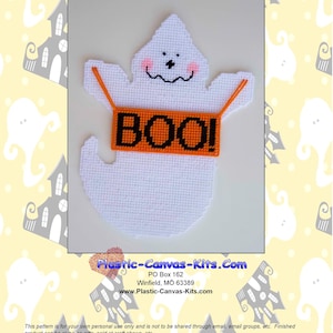 May include: A white plastic canvas ghost with a black face and a red mouth holding a banner that says "BOO!" in black letters on an orange background. The ghost is hanging from the banner. This is a pattern for a plastic canvas craft project.