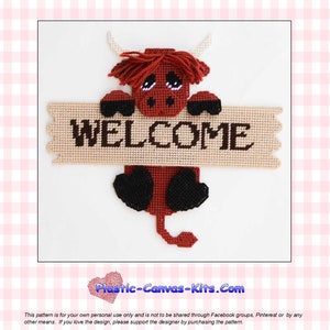 May include: A plastic canvas pattern featuring a red Highland cow holding a sign that says "WELCOME". The pattern is for a craft project and is available for purchase.