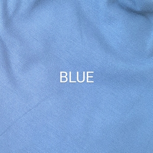 May include: A close-up of a blue fabric with a subtle texture. The word "BLUE" is printed in white in the center of the image.