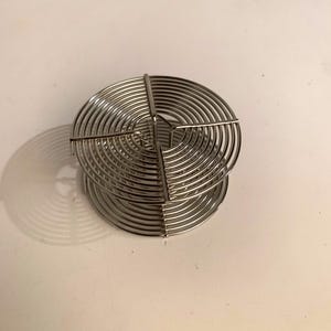 Stainless steel film developing reel. 35mm size
