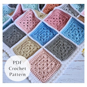 May include: A handmade crochet blanket featuring a patchwork design of colorful squares in shades of pink, blue, gray, and beige, with a white border. The text "PDF Crochet Pattern" is visible.