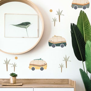 May include: A white wall decorated with a variety of colourful decals, including palm trees, surfboards, and vintage vans. The decals are arranged in a playful and whimsical pattern.