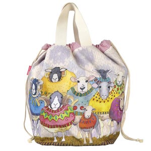 May include: A drawstring bag featuring a whimsical illustration of sheep wearing colorful sweaters. The bag has a cream-colored handle and a drawstring closure. The sheep are depicted in various colors, including blue, yellow, and pink.