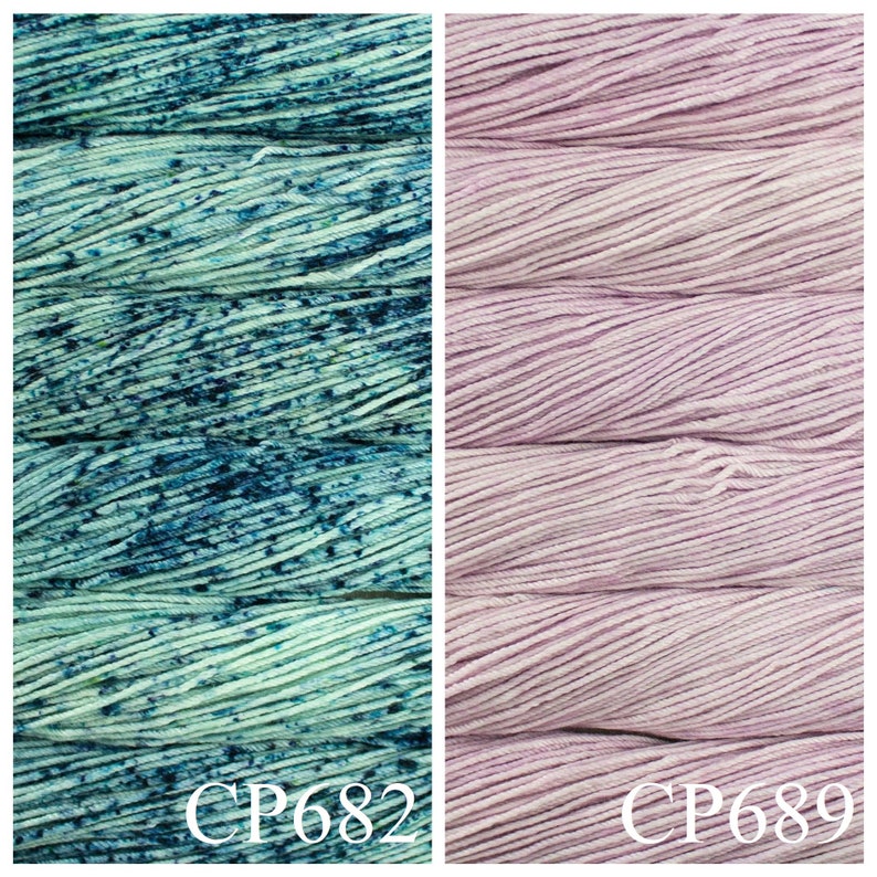 May include: Two skeins of yarn, one is a light blue with dark blue speckles, the other is a light pink. The skeins are labelled CP682 and CP689.