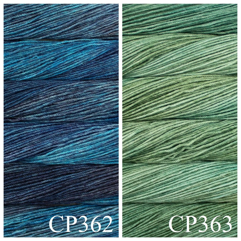 May include: Two skeins of yarn, one blue and green, and one green. The skeins are labelled CP362 and CP363.