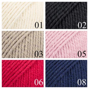 K&ouml;nnte beinhalten: Eine Sammlung von Garnproben in verschiedenen Farben, darunter Wei&szlig;, Schwarz, Beige, Rosa, Rot und Dunkelblau. Das Garn ist in einem Raster angeordnet, wobei die Zahlen 01, 02, 03, 05, 06 und 08 jede Probe kennzeichnen.