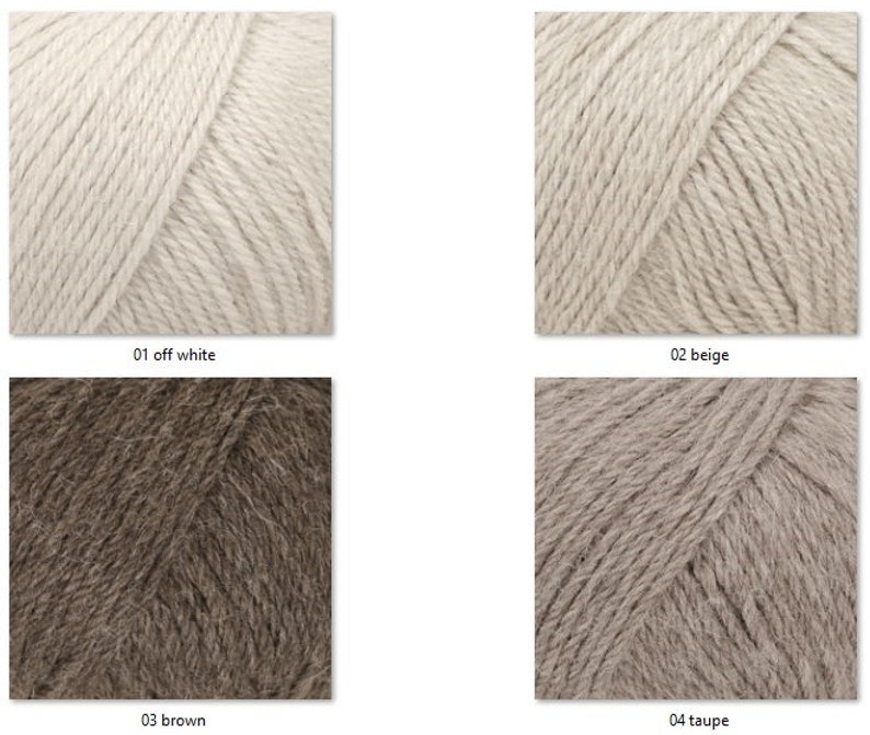 May include: Close-up of four skeins of yarn in various neutral colors: off-white, beige, brown, and taupe. Each skein is labeled with its color name and number. The yarn appears soft and textured, suitable for knitting or crochet projects.