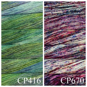 May include: Two skeins of yarn, one green and blue with a variegated pattern and one with a white, pink, and purple variegated pattern. The skeins are labelled CP416 and CP670.